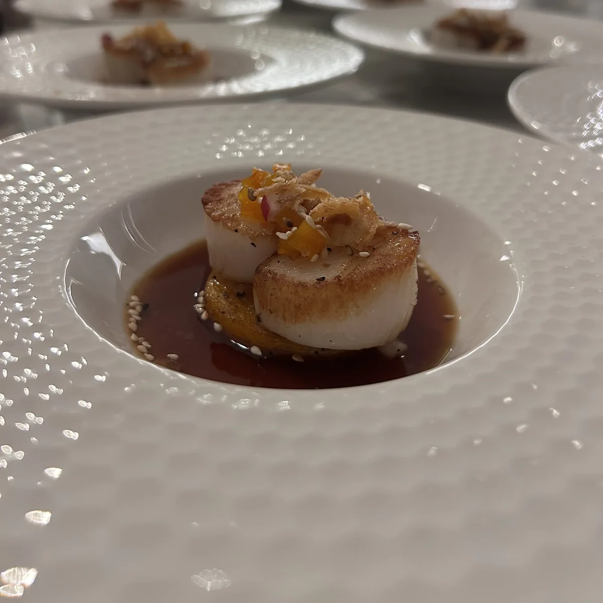 Pan seared scallops with citrus and crispy shallot